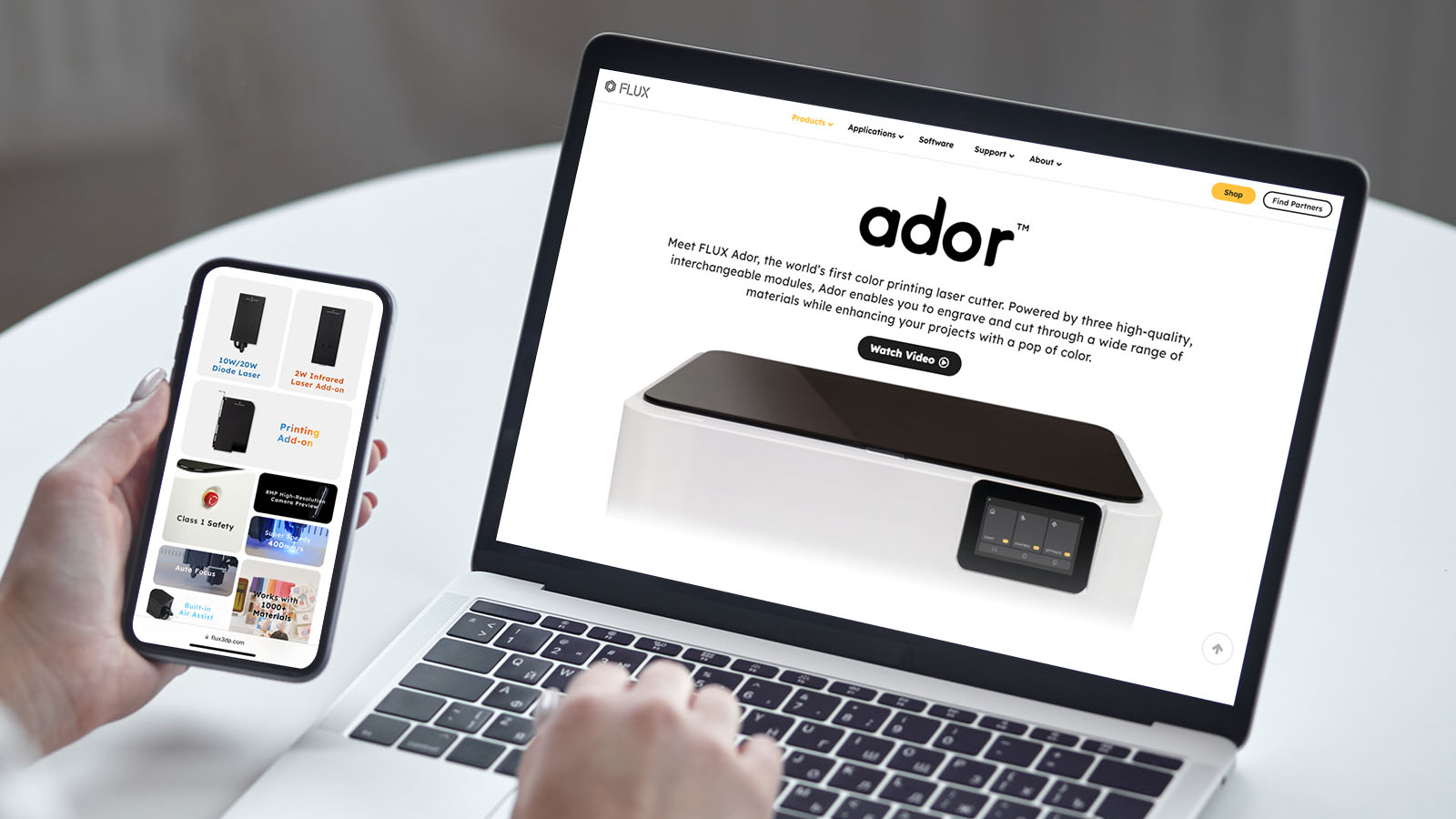 Ador product page shown on a laptop and phone held by someone browsing the site.